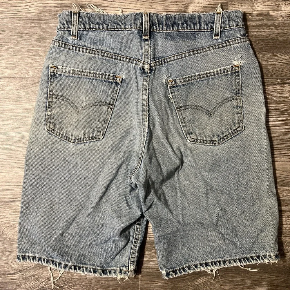 Vintage Levi's 550 Heavily Distressed Light Wash Blue Jean Shorts Size 32x10 USA